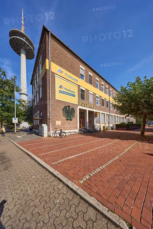 Deutsche Post AG, post office at Berliner-Tor-Platz and television tower against blue sky with cirrostratus clouds in Wesel, Lower Rhine, Wesel district, North Rhine-Westphalia, Germany, Europe