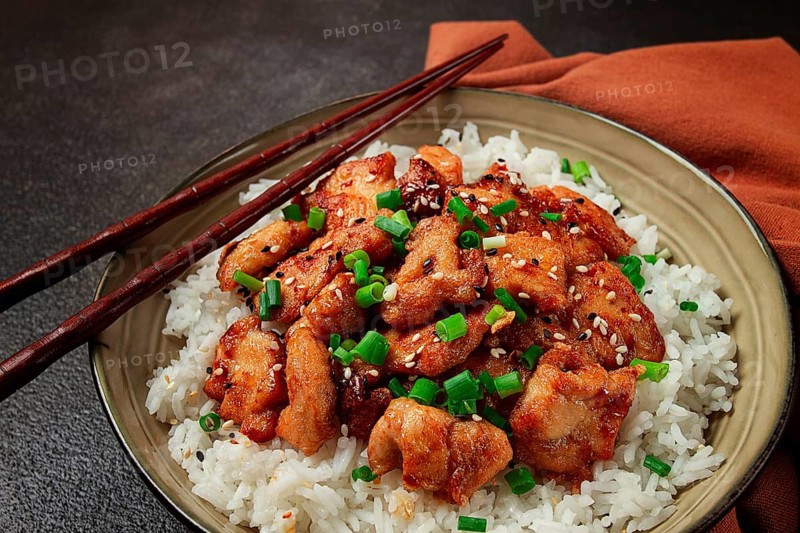 Fried chicken teriyaki with rice, green onion and sesame, homemade, no people