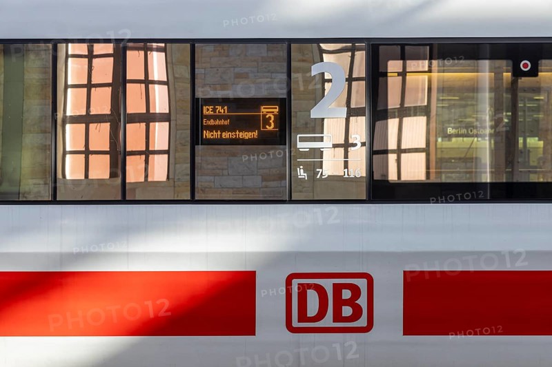 ICE with Deutsche Bahn AG logo, reflection in the train window. Display with the inscription Endbahnhof, nicht Einsteigen. Ostbahnhof Berlin, Germany, Europe