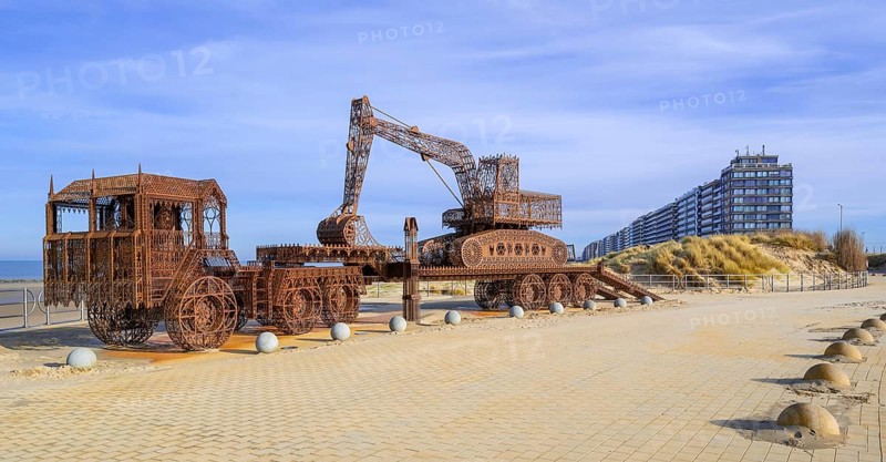 Caterpillar + Flatbed Trailer, artwork by Belgian neo-conceptual artist Wim Delvoye at seaside resort Westende, Middelkerke, West Flanders, Belgium, Europe