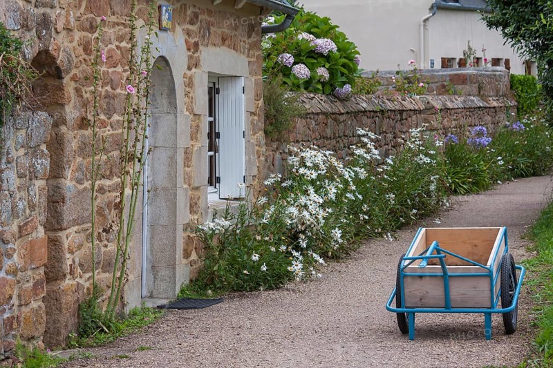 Typical alley, path on the Ile de Brehat, handcart as a transport aid on the car-free island, Ile de Brehat, Brittany, France, Europe