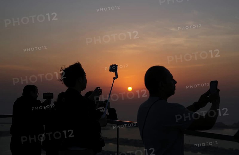Tourists take selfie with smartphone, selfie stick, The View At the Palm, Palm Jumeirah, sunset, evening mood, Dubai, United Arab Emirates, VAR, Asia