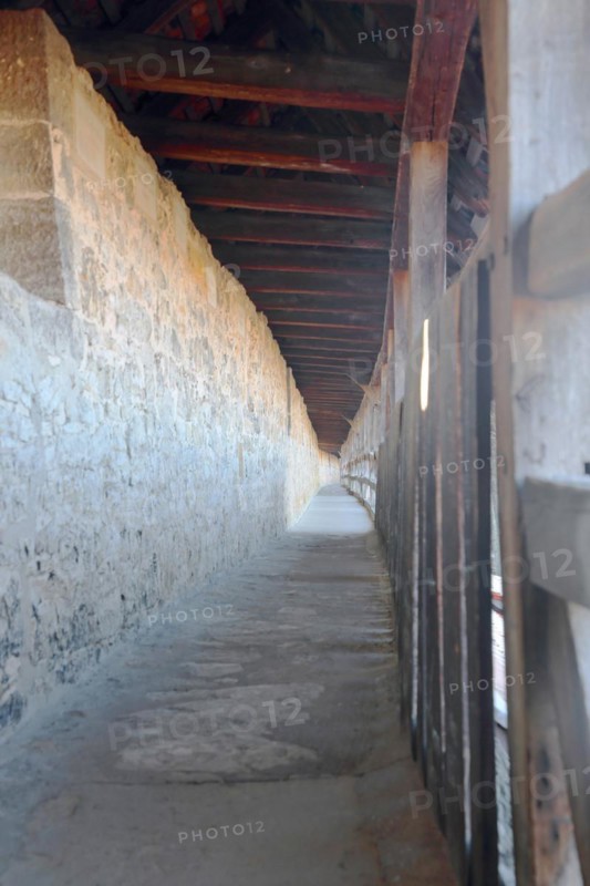 Covered long walkway of the historic town fortifications, town wall, interior view, vanishing point, Rothenburg ob der Tauber, Tauberfranken, Franconia, Bavaria, Germany, Europe