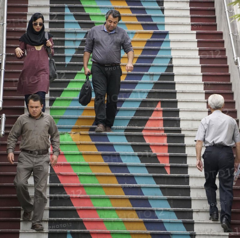 People walk down a painted staircase. The city of Tehran is changing the image of the city through art objects in public spaces, 21/05/2016