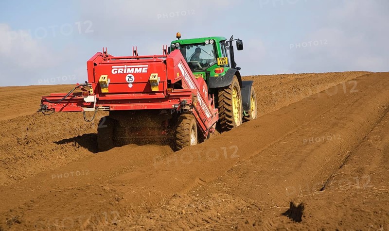 Grimme 25 de-stoner machinery preparing soil for crop of potatoes in a field, Shottisham, Suffolk, England, United Kingdom, Europe