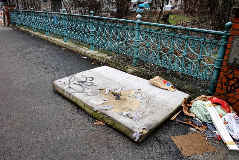 A mattress lying on a pavement, illegal waste disposal in the Berlin district of Wedding, 15/02/2024