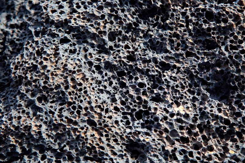 Close up of air holes in rock formed from volcanic lava flow, Fuerteventura, Canary Islands, Spain, Europe