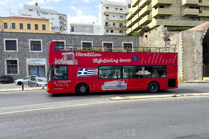 Red double decker bus with open air seats open air for city tour sightseeing tour sightseeing tour through in Heraklion Iraklion, Heraklion, Crete, Greece, Europe