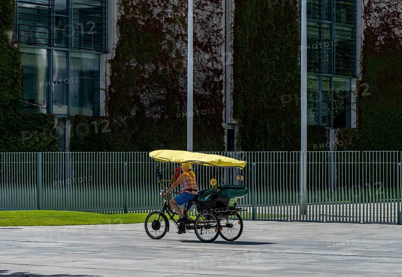Tourists on bicycles, fence at the Federal Chancellery, Berlin, Germany, Europe
