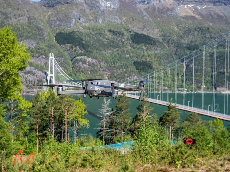 Drone flying near the Hardanger suspension bridge, bridge Hardangerbrua over the Hardangerfjord, spring, Hardanger, Norway, Europe