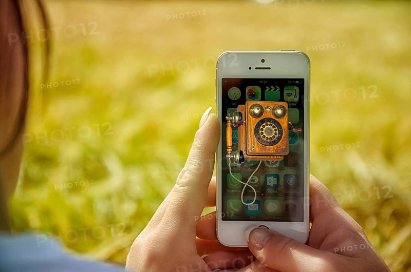 Symbolic image, telephone, mobile phone, smartphone, progress, future, old times, innovation, nostalgia, technological change, industry, telephony, inventor, researcher, history, Germany, Internet, network policy, radio masts, old and modern times, ancient telephone, crank for connection, 5G telephony, worldwide connections, Europe