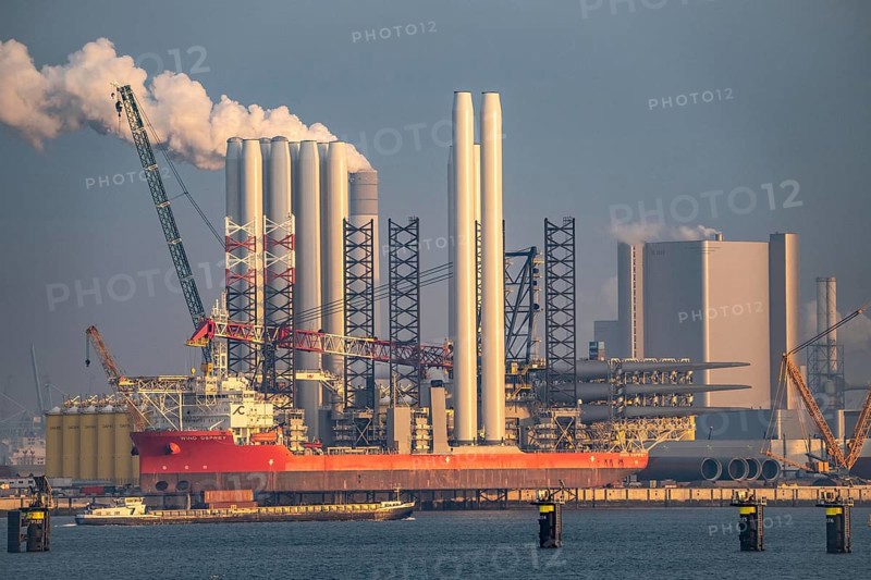 SIF Offshore Foundaitons, production of foundations for offshore wind turbines, the wind turbines are mounted on these pipes, which are installed in the seabed at water depths of up to 60 metres, production plant in the seaport of Rotterdam, Maasvlakte 2, behind the UNIPER coal-fired power plant, Rotterdam Netherlands