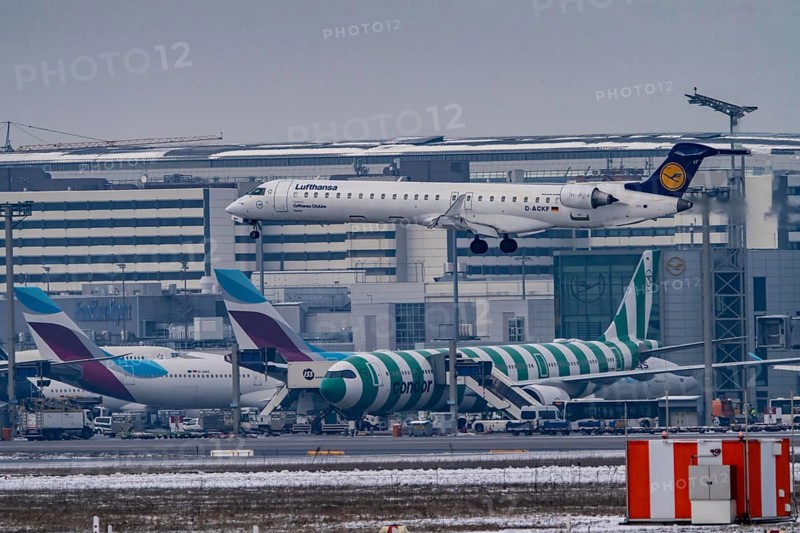 Lufthansa Cityline, Bombardier CRJ-900 approaching Frankfurt FRA airport, terminal building, Fraport, in winter, Hesse, Germany, Europe