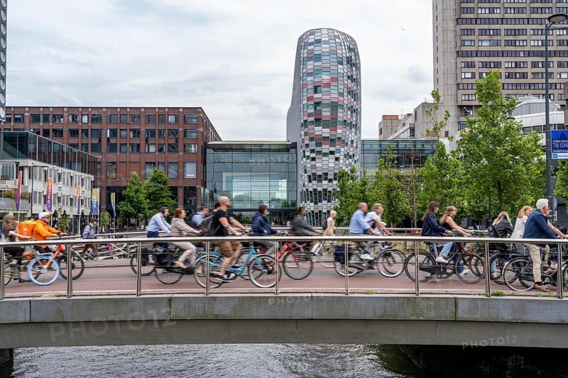 Central cycle path on the Vredenburgviaduct, at the Hoog Catharijne shopping centre, behind Utrecht Centraal station, in the city centre of Utrecht, heavy traffic, Netherlands