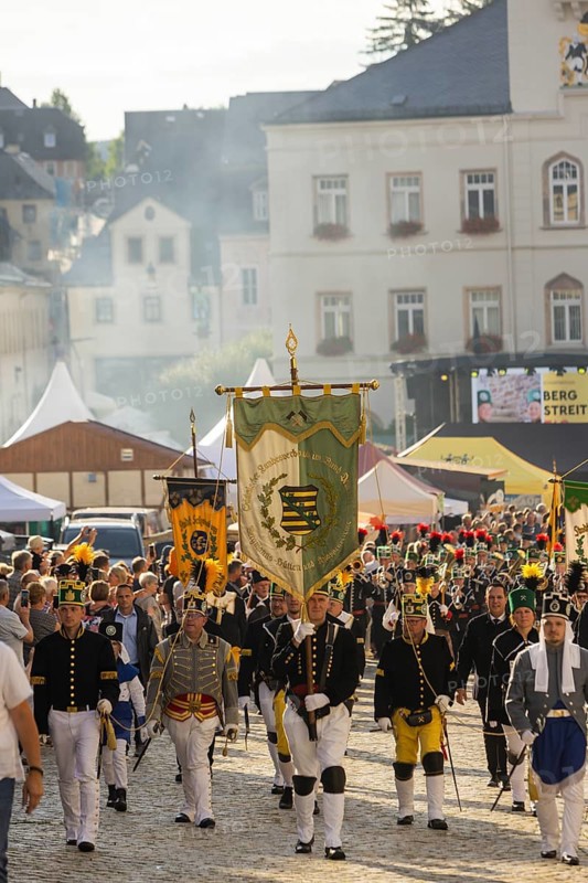 The so-called Bergstreittag is a beautiful centuries-old tradition and is celebrated on 22 July, the church memorial day and former feast day of Mary Magdalene in Schneeberg. The four quarterly sermons introduced in 1649 remained in place until 1845. These sermons were then abolished in favour of a single day, 22 July, which fell on Mary Magdalene. The Freiberg Mining Office recommended that this day should be celebrated with a festival and a mountain parade. In 1846, the Royal Ministry of Finance issued a decree to celebrate St Mary Magdalene's Day with a sermon and a magnificent mountain procession. The last major procession took place in July 1913. The First World War put an end to these processions. The tradition was not revived until July 1933, 528th Bergstreittag, mountain parade, Schneeberg, Saxony, Germany, Europe