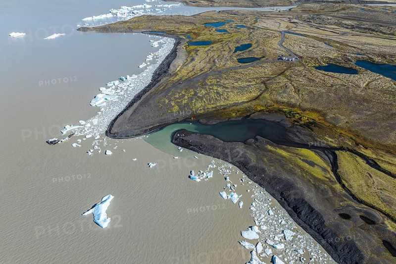 Aerial view over the glacial lake Fjallsárlón, glacier Fjallsjökull, part of Vatnajökull glacier, Iceland, Europe