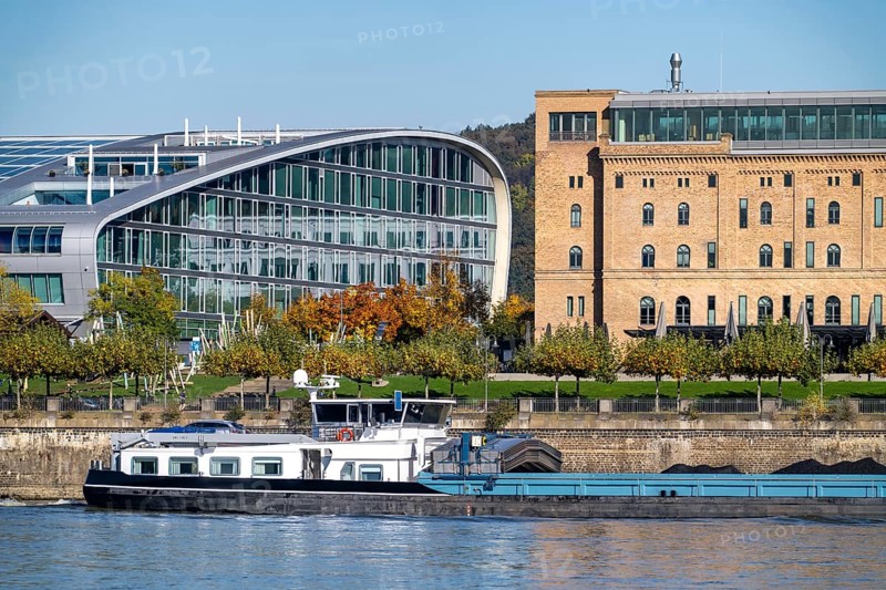 The Kameha Grand Hotel in Bonn, directly on the Rhine, Bonn-Beuel, cargo ship, historic Rohmühle building, North Rhine-Westphalia, Germany, Europe