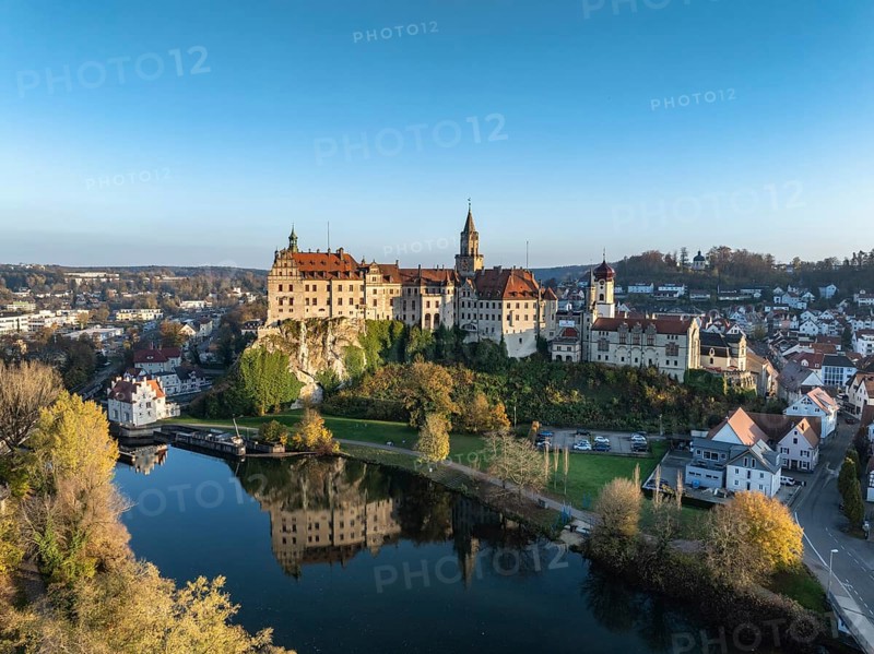 Aerial view of the town of Sigmaringen with the Hohenzollern Castle, a sight and tourist attraction above the old town and the Danube with autumnal vegetation, Danube valley, district of Sigmaringen, Baden-Württemberg, Germany, Europe