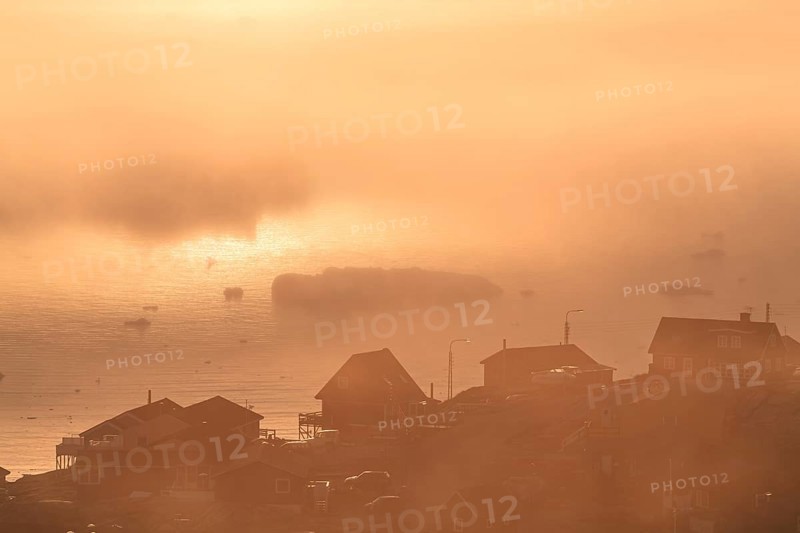 Inuit settlement in front of icebergs in the fog, midnight sun, summer, Ilulissat, Ilulissat Icefjord, Disko Bay, West Greenland, Greenland, North America