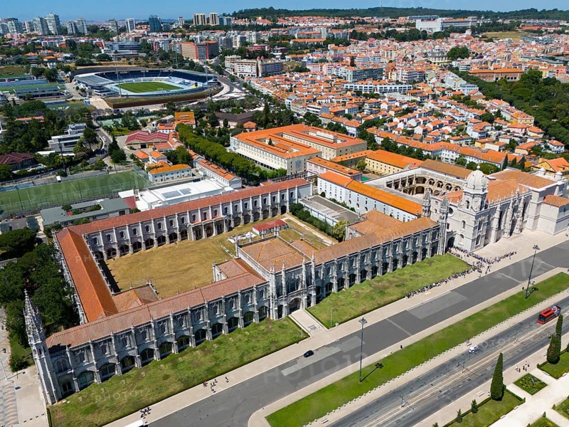 Aerial view of a large monastery in an urban landscape with green areas and urban structures in the background, aerial view, Jerome Monastery, Mosteiro dos Jerónimos, Jerome Monastery, World Heritage Site, Monastery Church of Santa Maria, Belém, Belem, Bethlehem, Lisbon, Lisboa, Portugal, Europe