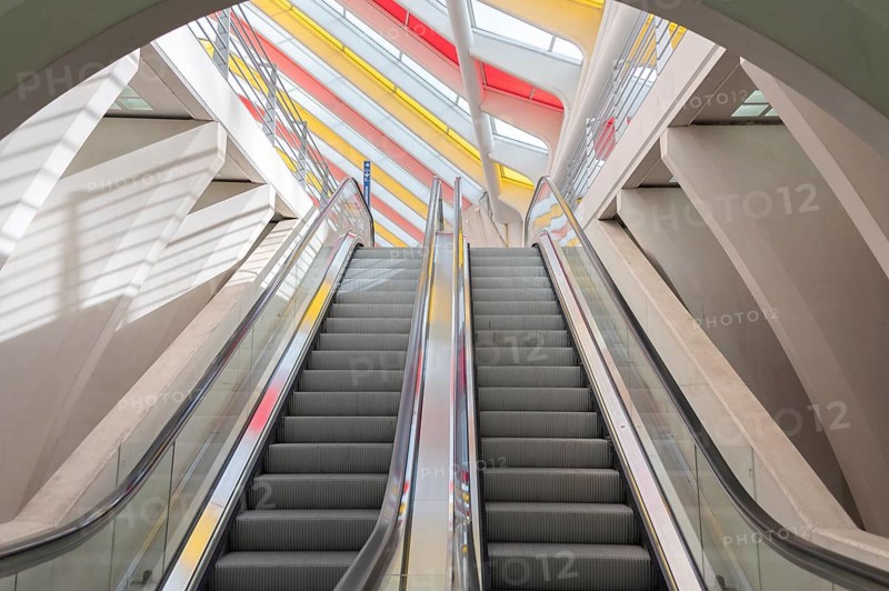Liège-Guillemins railway station, architect Santiago Calatrava, colourful roof, escalators upwards, light and shadow, Liège, Belgium, Europe