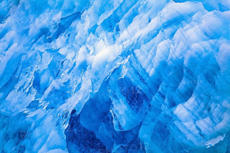 Blue ice patterns on a glacier wall in the arctic, Svalbard, Norway, Europe