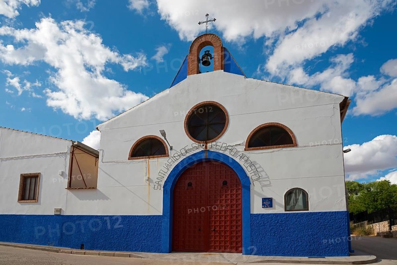 A white and blue church with a bell tower under a cloudy sky, Ermita de San Pedro, Campo de Criptana, Ciudad Real province, Castilla-La Mancha, Don Quixote Route, Spain, Europe