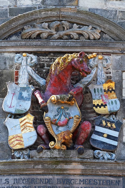 City coat of arms with unicorn on the historic Hoofdtoren defence defence tower in the harbour of Hoorn, Markermeer, part of the IJsselmeer, province of North Holland, West Friesland, Netherlands