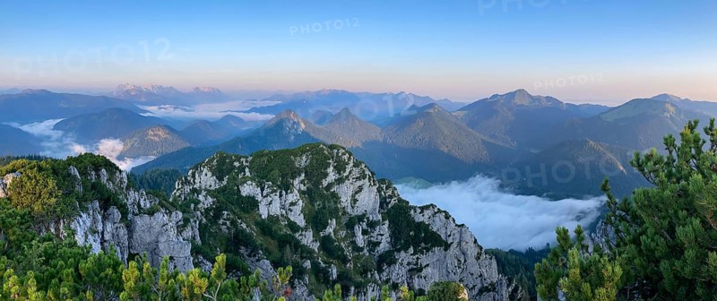 Panorama from the Gurnwandkopf at sunrise, to the left the Wilder Kaiser, then the Chiemgau Alps with Geigelstein, Hochgern and Hochfelln, Bavaria, Germany, Europe
