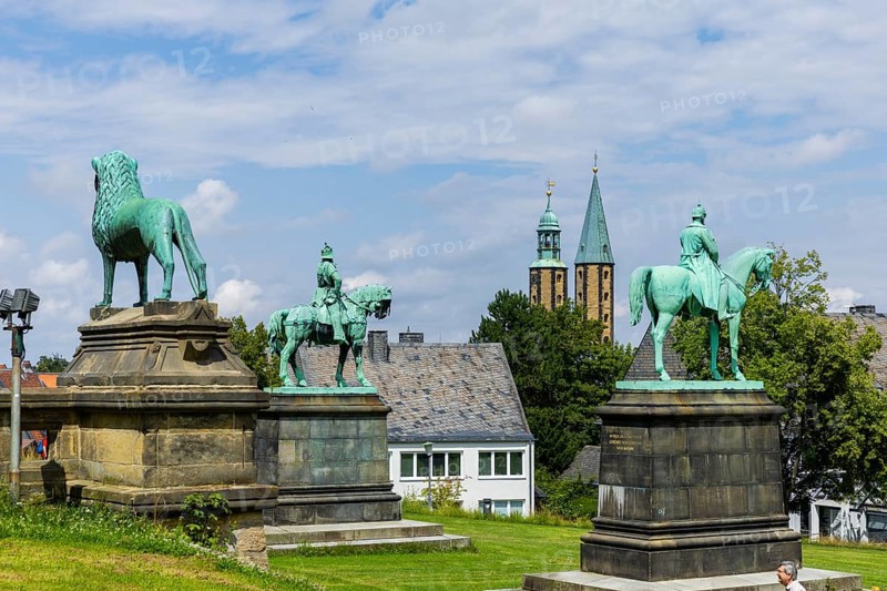 The imperial palace of Goslar covers an area of around 340 by 180 metres, situated at the foot of the Rammelsberg in the south of the town of Goslar, on which the imperial house, the former collegiate monastery St. Simon and Judas, the palace chapel of St. Ulrich and the Church of Our Lady are or were located. The imperial palace, built between 1040 and 1050 under Henry III, is a unique monument to secular architecture. For over 200 years, German and European history was written here at numerous imperial and court conventions. Copies of the Brunswick Lion and equestrian monuments in front of the imperial palace, Kaiserpfalz Goslar, Goslar, Lower Saxony, Germany, Europe