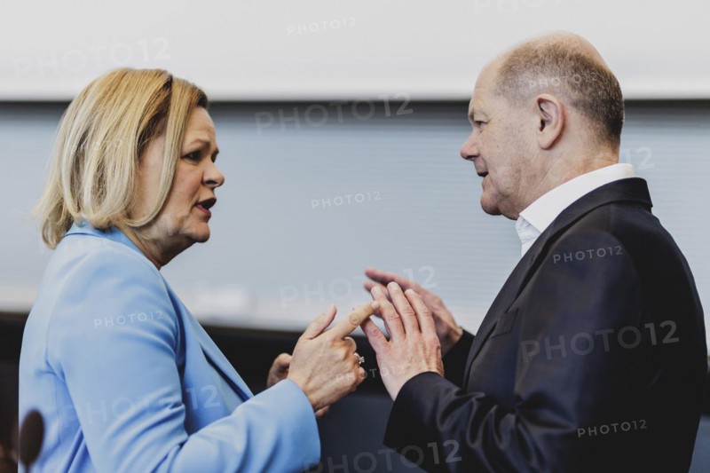 (R-L) Olaf Scholz (SPD), Federal Chancellor, and Nancy Faeser (SPD), Federal Minister of the Interior and Home Affairs, pictured in front of the parliamentary group meeting of the SPD parliamentary group in Berlin, 23 April 2024