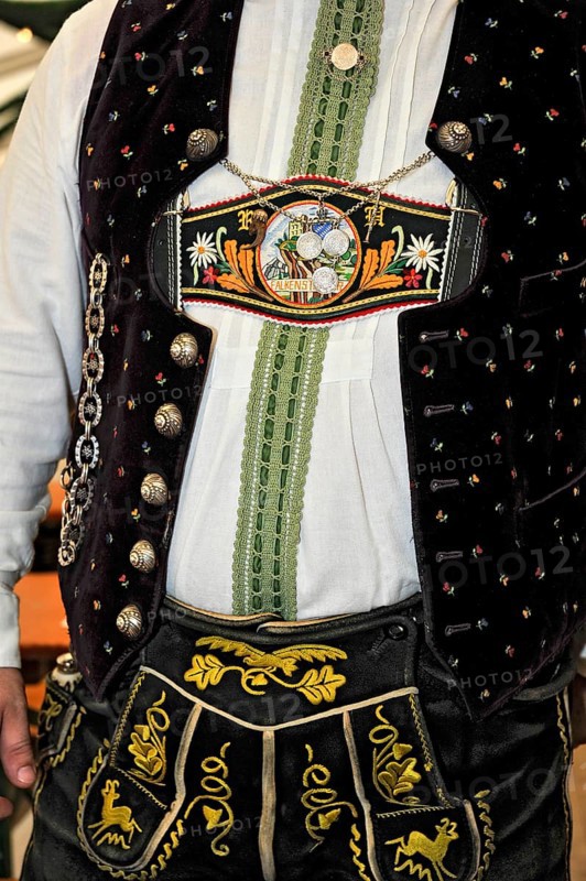 Man in traditional traditional costume, lederhosen and braces with colourful embroidery, Bavarian mountain costume, old festival tent, historic Wies'n, Oide Wiesn, Oktoberfest, Munich, Upper Bavaria, Bavaria, Germany, Europe