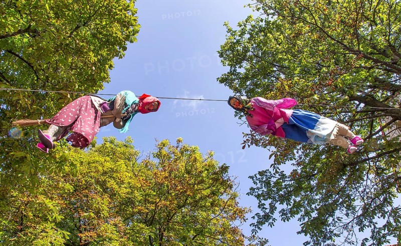 A witch, the mascot of the 114th German Hiking Day, hangs from a lofty height in Bad Harzburg, 14/08/2014, Bad Harzburg, Lower Saxony, Germany, Europe