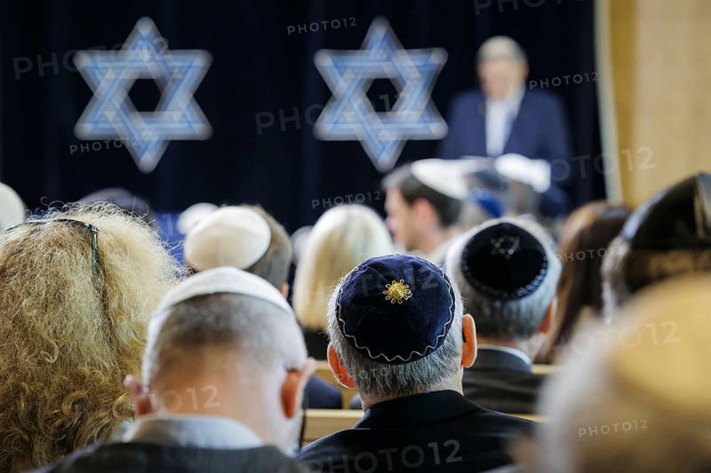 Men with kippas sit in the synagogue during the inauguration of the synagogue centre in Potsdam Berlin, 04.07.2024