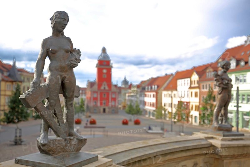 Two sculptures Prudentia and Caritas by Bernd Göbel 2021 on balustrade with blurred Old Town Hall, allegory, Greek mythology, virtues, virtue, prudence, wisdom, love, woman standing, depth of field, blur, horse trough, main market, Gotha, Thuringia, Germany, Europe