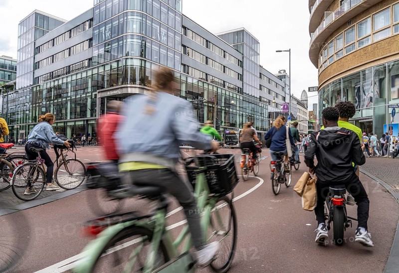 Central cycle path on the Lange Viestraat, in the centre of Utrecht, lanes for pedestrians, cyclists and cars are separated, heavy traffic, Netherlands