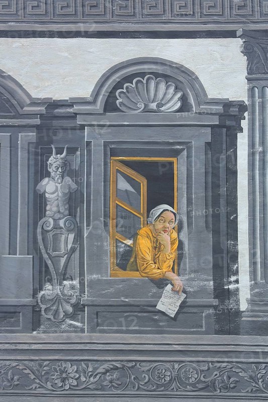 House wall with window and yellow woman leaning out, grey illusion painting, ornaments, sgraffiti and decorations, illusion painting, look, wall painting, arts and crafts, detail, market place, Engen, Hegau, Baden-Württemberg, Germany, Europe