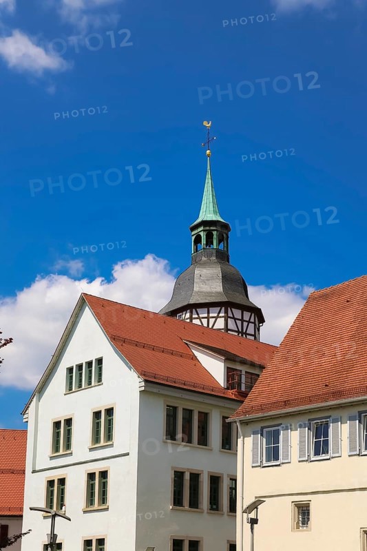 Church tower of the collegiate church of St Pancratius, Protestant collegiate church, sacred building, residential building in front, Backnang, Rems-Murr-Kreis, Baden-Württemberg, Germany, Europe