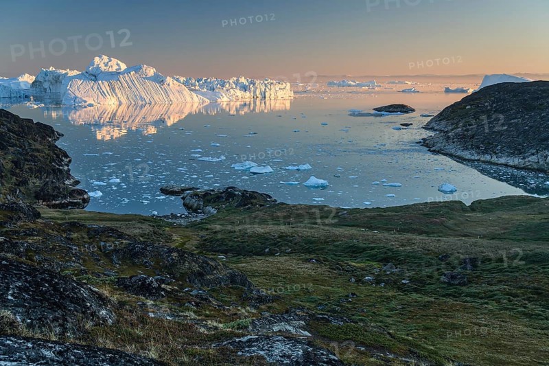 Icebergs and ice floes reflected in the water, summer, midnight sun, Jakobshavn glacier and ice fjord, Ilulissat Kangerlua, Disko Bay, West Greenland, Greenland, North America
