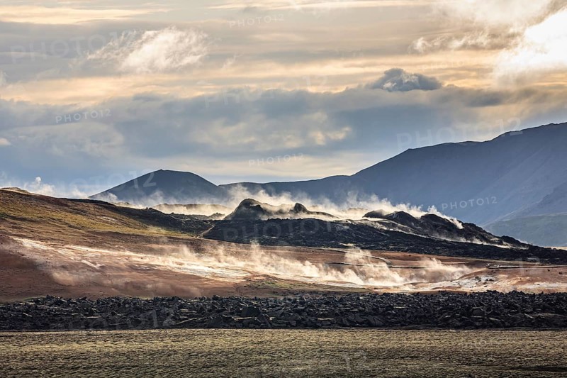 Geothermal field in front of mountain landscape, clouded, backlight, Krafla, Myvatn, North Iceland, Iceland, Europe