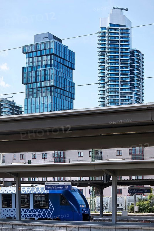 Main railway station with local train with the skyscrapers The Spin and Grand Tower, Frankfurt am Main, Hesse, Germany, Europe