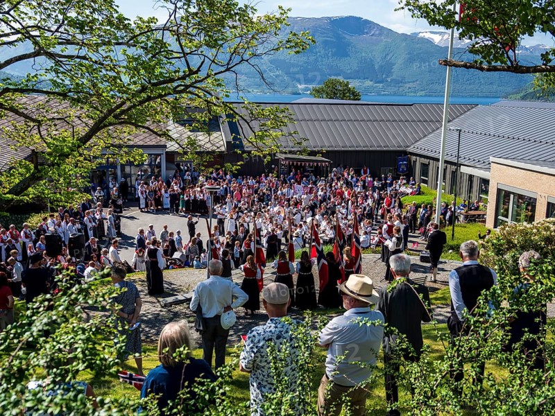 Norwegian national day celebration, 17. may, parade with music, norwegian flags, village Rosendal, Hardanger, Norway, Europe