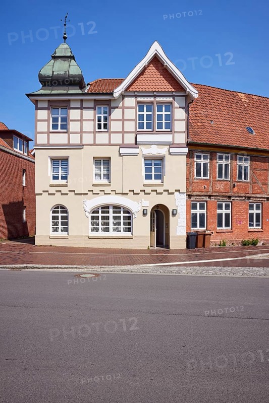 Listed residential building with imitation half-timbering, Welscher bonnet and triangular gable against a blue sky in Stade, Hanseatic city, district of Stade, Lower Saxony, Germany, Europe