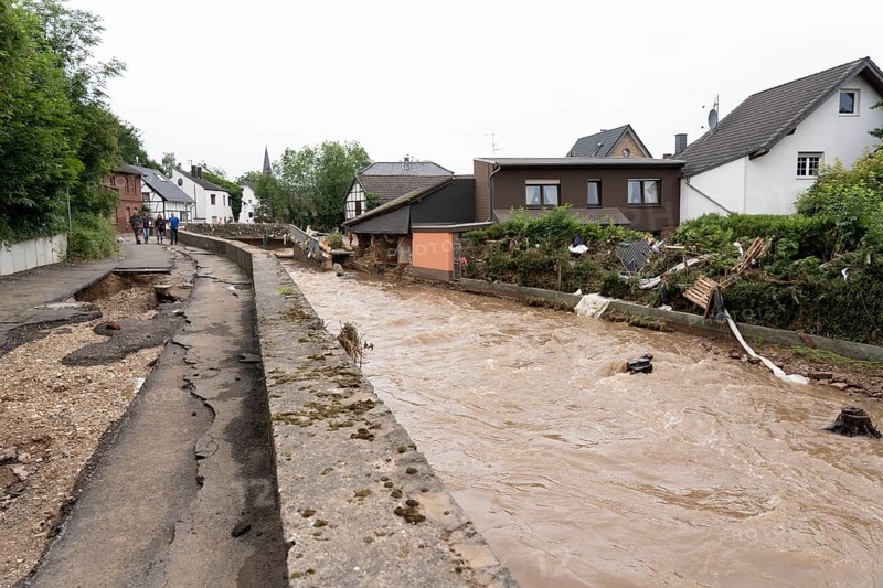 Flood in North Rhine-Westphalia, the village of Iversheim on the Erft was almost completely flooded Damage to almost all buildings and the road, clean-up work, washed-out road, Iversheim, district of Bad Münstereifel, North Rhine-Westphalia, Germany, Europe