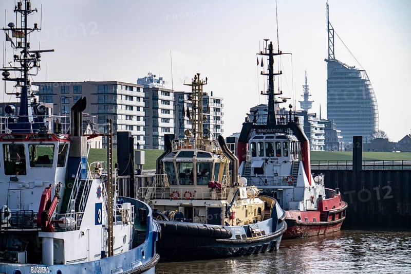 Harbour tugs, tugboats, towboats, at the tugboat pier, Atlantic Sail City Hotel, in the seaport of Bremerhaven, Bremen, Germany, Europe