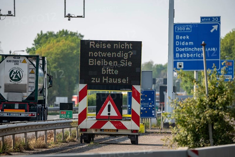 German-Dutch border at Emmerich-Elten, A3 motorway, signal board asks travellers to only make necessary journeys to the Netherlands, effects of the corona crisis in Germany