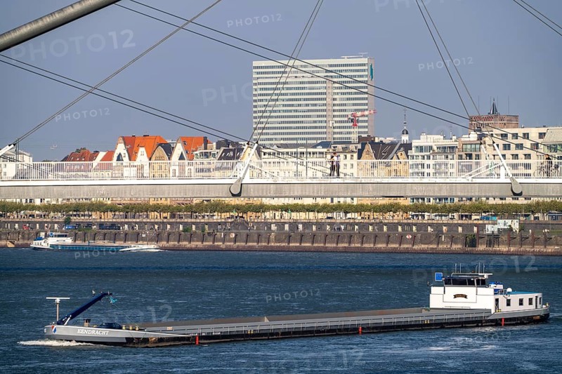 Cargo ships on the Rhine near Düsseldorf, bridge over the Media Harbour, Oberkassler Rhine Bridge, Old Town embankment, Dreischeibenhaus, North Rhine-Westphalia, Germany, Europe