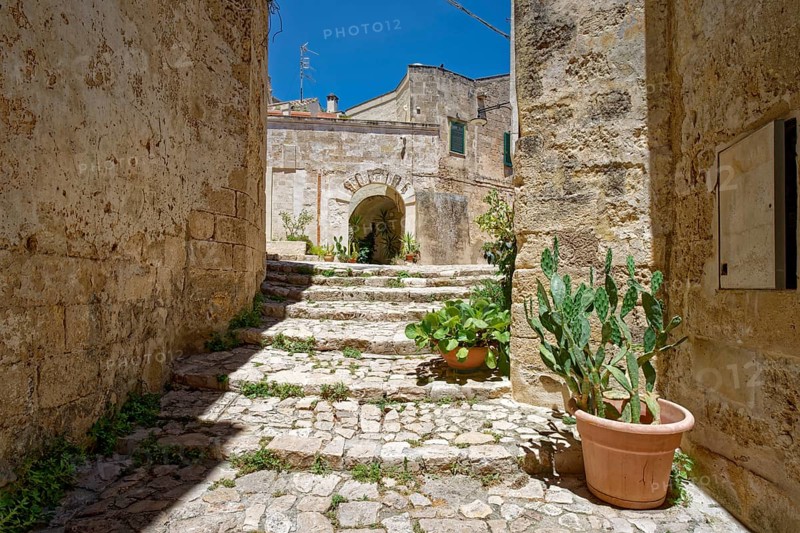 Paths and corridors in the tuff of the Sassi Barisano in the cave town of Matera. The cave settlements, Sassi, are a UNESCO World Heritage Site. Matera, Basilicata, Southern Italy, Southern Europe