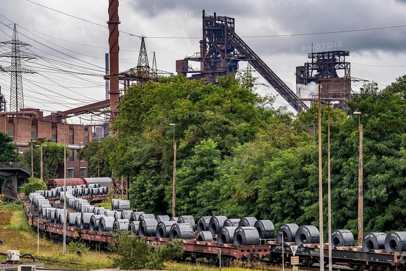Blast furnace Schwelgern 2, strip steel rolls, coils, on freight wagons, at the ThyssenKrupp Steel plant Schwelgern in Duisburg-Marxloh belongs to the Bruckhausen steelworks, North Rhine-Westphalia, Germany, Europe