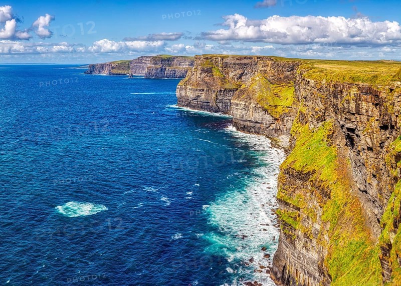 Dramatic cliff landscape with impressive coastline and deep blue water, Cliffs of Moher